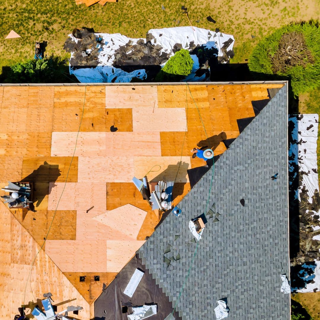 Roofer installing new shingles during a Bay Area roof replacement
