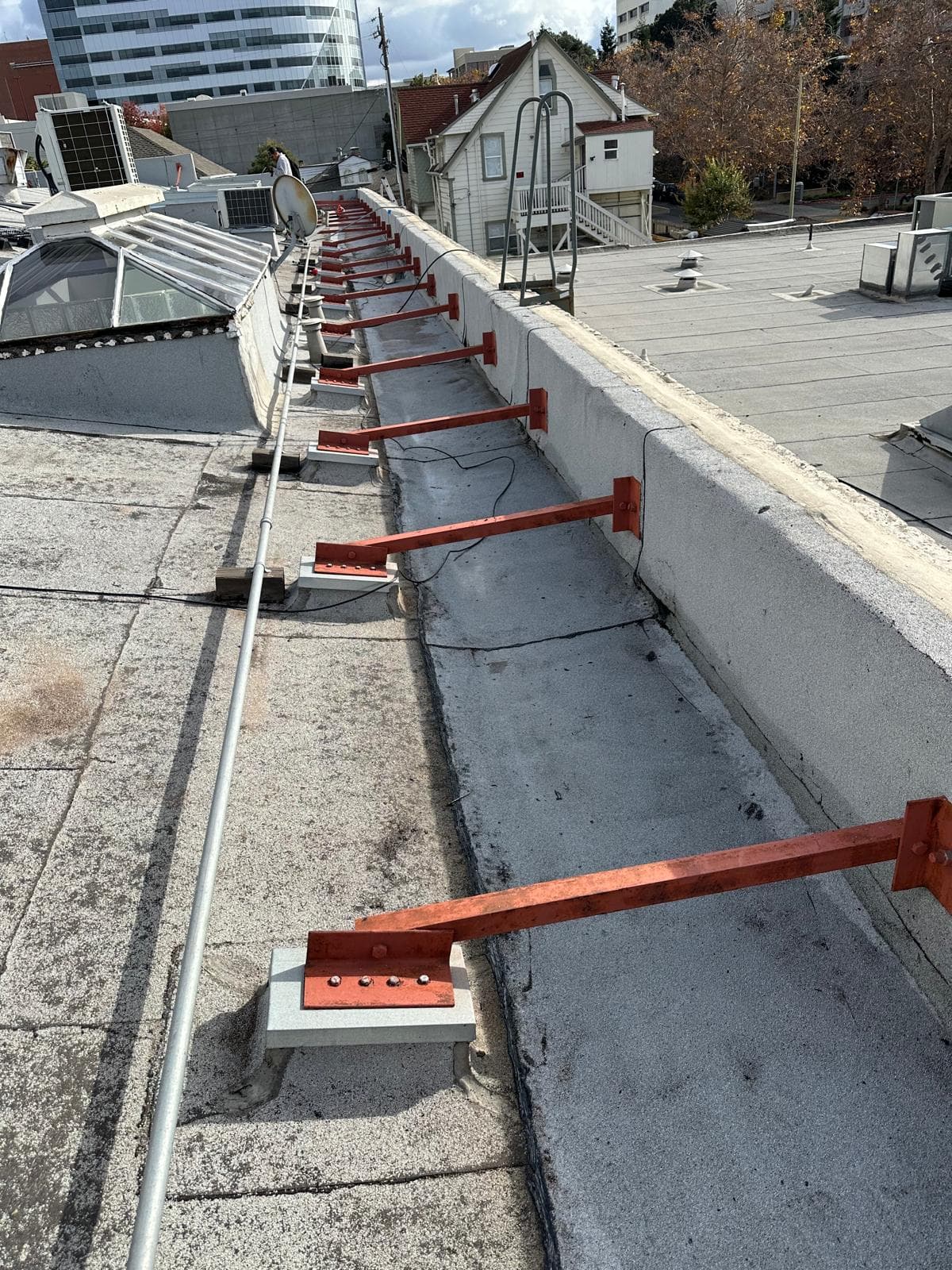 Structural braces on a commercial roof edge